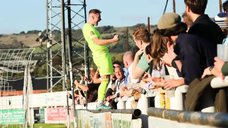 Jake Evans celebrates with the Hungerford Town fans. Photo: Jeff Youd.