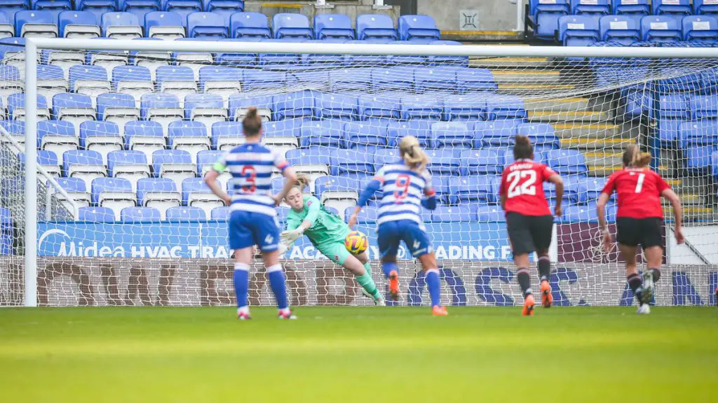 Jacqui Burns makes a penalty save from Katie Zelem. Photo: Neil Graham.