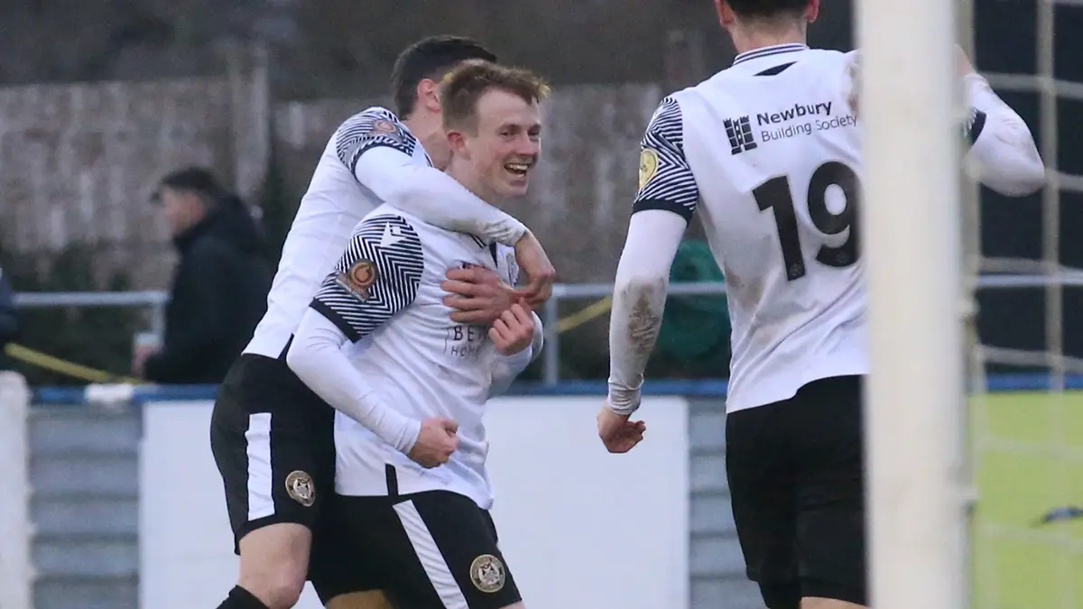 Ryan Jones is mobbed by his Hungerford Town teammates. Photo: Jeff Youd.
