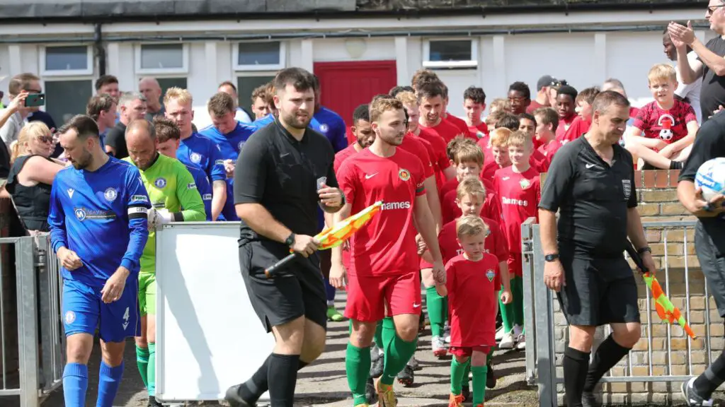 Ben Catt leads out the Windsor side for their historic first home game. Photo: Richard Milam.