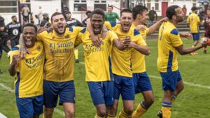 Woodley United celebrate reaching the FA Vase Second Round. Photo: Trevor Smith.