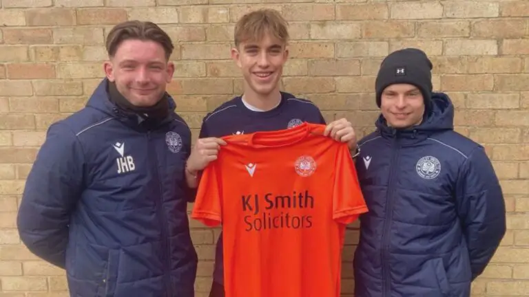 Conor Clark (centre) with Woodley United manager Jordan Blake. Photo: Woodley United.