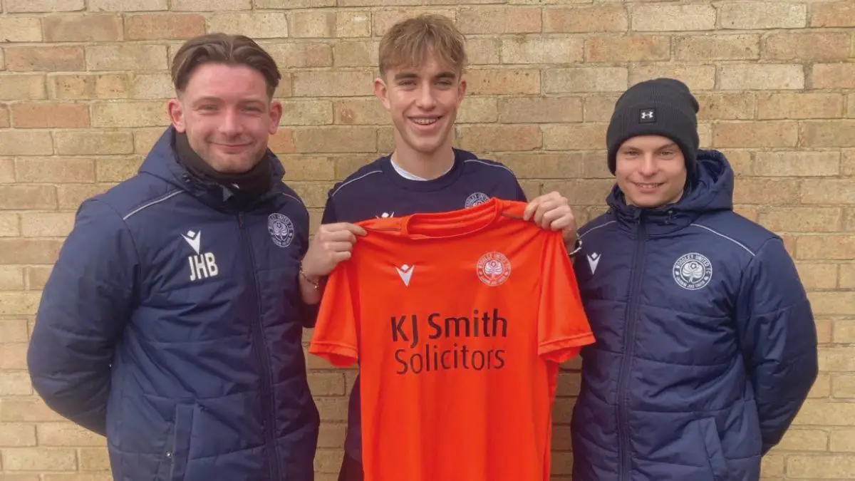 Conor Clark (centre) with Woodley United manager Jordan Blake. Photo: Woodley United.