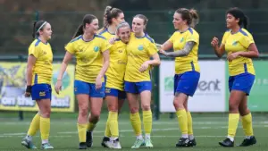 Ascot United Women celebrate scoring against Woodley United. Photo: Andy Wicks.