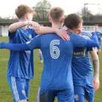 Ellis Cowd (6) is embraced by his Reading City team mates. Photo: Reading City FC.