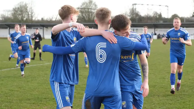 Ellis Cowd (6) is embraced by his Reading City team mates. Photo: Reading City FC.