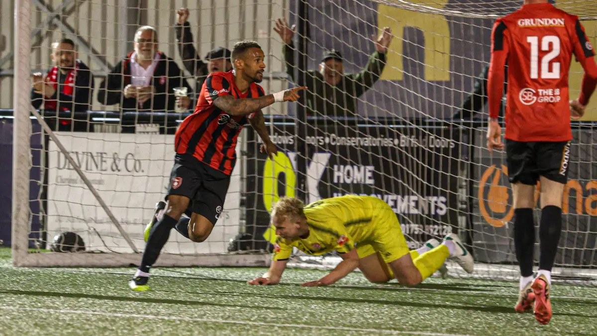 Jordan Esprit scores for Bracknell Town in the County Cup Final. Photo: John Leakey.