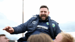 Ascot United manager Jamie Tompkins is held aloft after guiding his side to the FA Vase Final. Photo: Neil Graham.