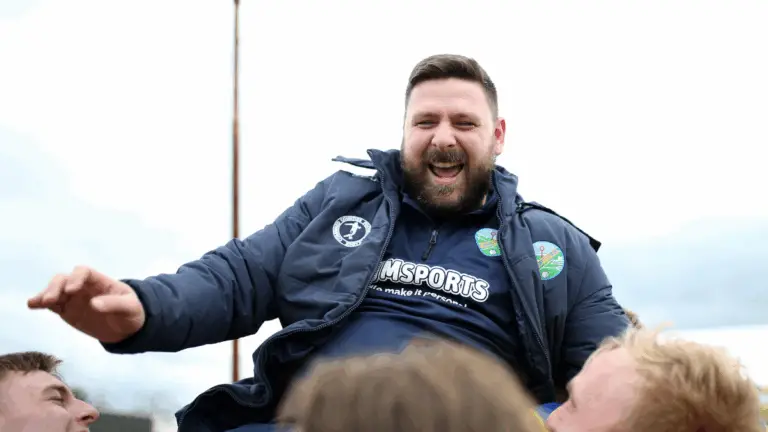 Ascot United manager Jamie Tompkins is held aloft after guiding his side to the FA Vase Final. Photo: Neil Graham.