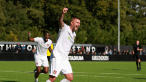 Sam Magri celebrates scoring for Bracknell Town. Photo: John Leakey.