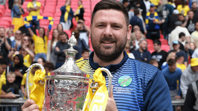 Jamie Tompkins with the FA Vase at Wembley. Photo: Neil Graham.