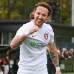 Joe Grant celebrates scoring for Bracknell Town. Photo: John Leakey.
