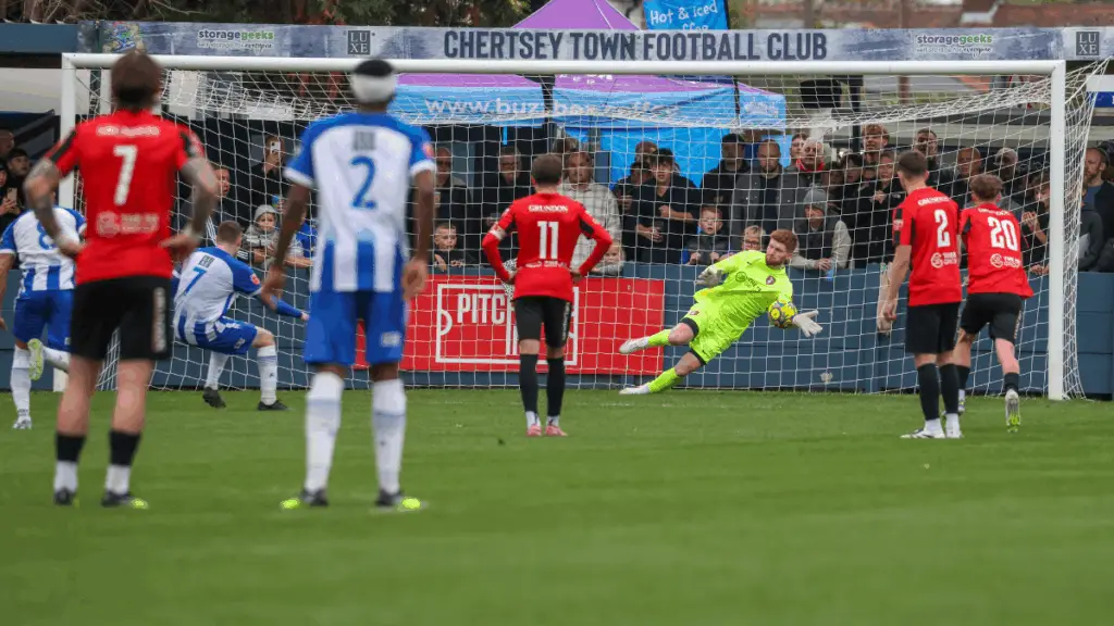 Harvey Randle randle saves a penalty. Photo: John Leakey.