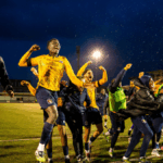 Slough Town celebrate their FA Cup win over Altrincham. Photo: Zak Rana.