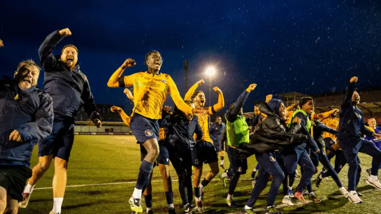 Slough Town celebrate their FA Cup win over Altrincham. Photo: Zak Rana.