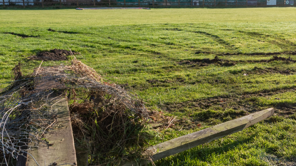 Broken fence and a damaged playing surface. Damage caused by vandals at Reading YMCA FC in November. Photo: Brian Baggaley.