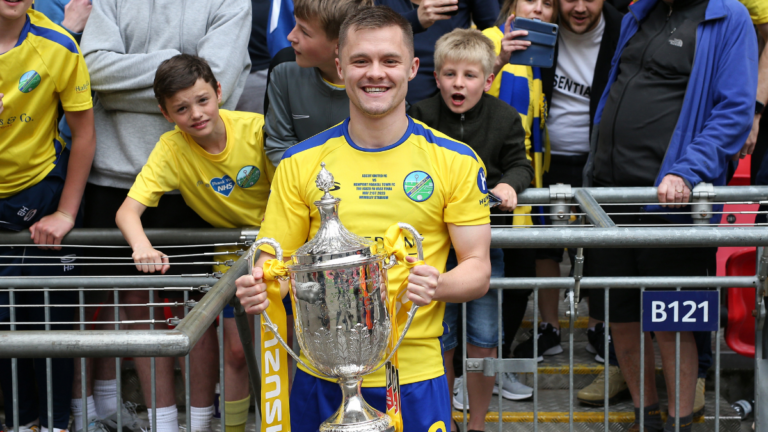 George Lock with the FA Vase at Wembley. Photo: Neil Graham.