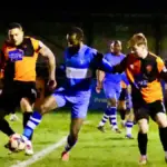 Action from Wokingham Town vs Burnham, won 3-0 by the visitors. Photo: Andrew Batt.