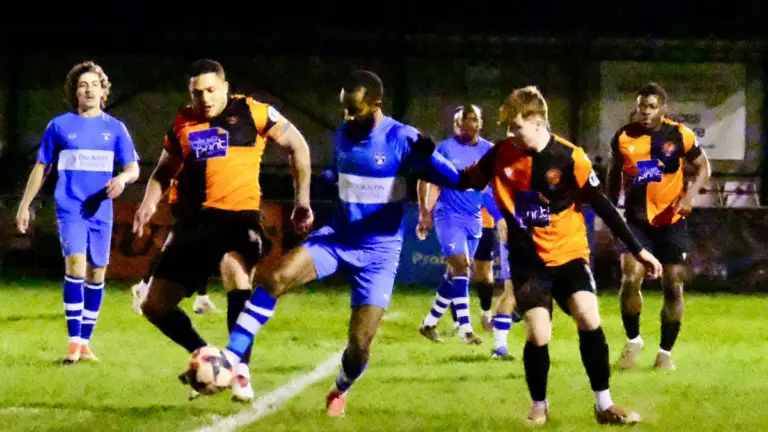Action from Wokingham Town vs Burnham, won 3-0 by the visitors. Photo: Andrew Batt.