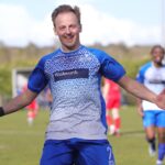 Ollie Noyes celebrates scoring a goal that keeps Eversley & California at Step 5. Photo: Richard Milam.