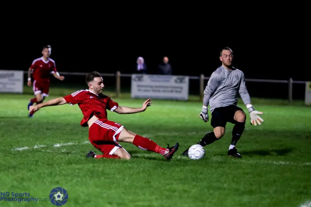 Adam Cornell scores for Bracknell Town FC against Thatcham Town. Photo: Neil Graham.