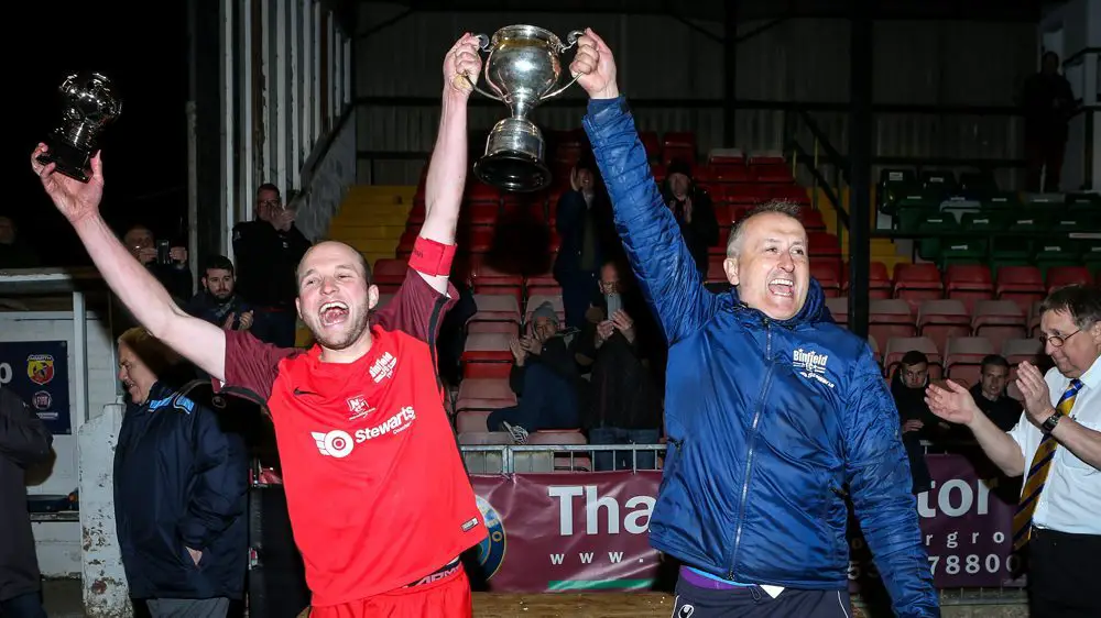Binfield captain James Knight and manager Roger Herridge lift the Floodlit Cup. Photo: Neil Graham.