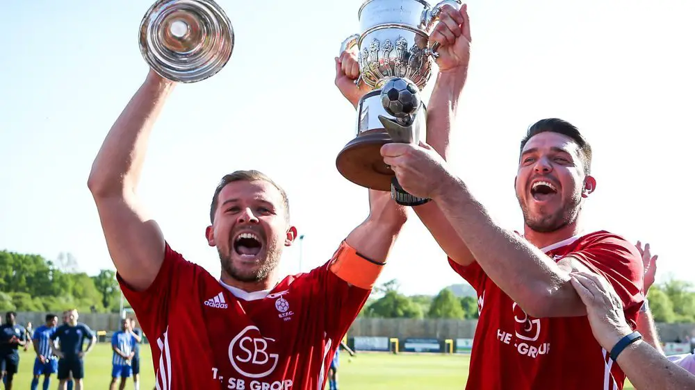 Bracknell Town captain Dave Hancock and manager Carl Davies lift the Hellenic League Challenge Cup. Photo: Neil Graham.