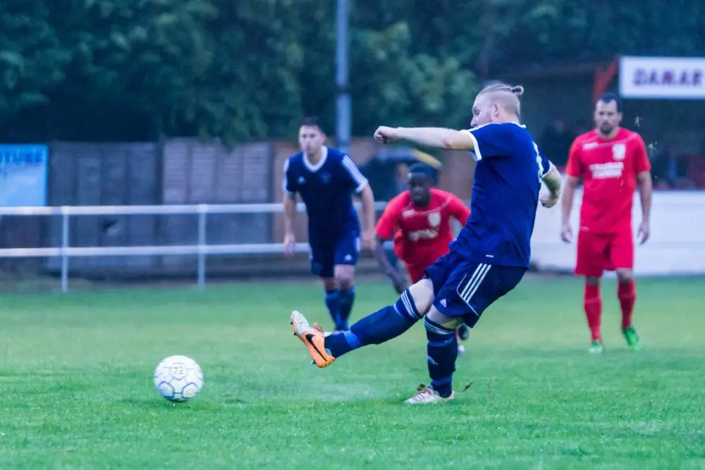 Callum Whitty scores a penalty for Bracknell Town at Flackwell Heath. Photo: Neil Graham.