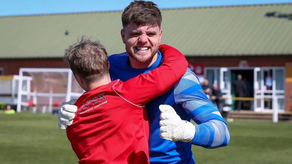 Chris Grace celebrates after Binfield's FA Vase penalty shoot-out win. Photo: Neil Graham / ngsportsphotography.com