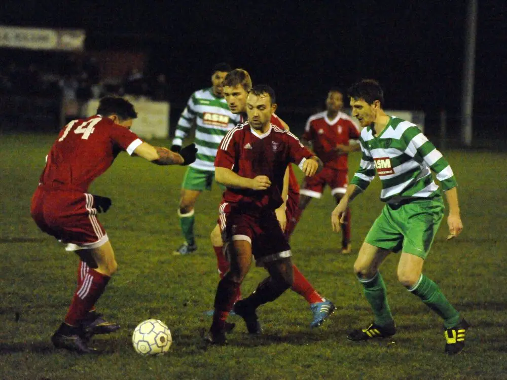 Jamie McClurg in action against Thame United. Photo: Mark Pugh.