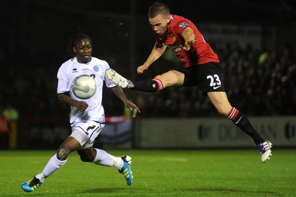 Jermaine McGlashan against Manchester United's Tom Cleverley in the Football League Cup. Photo: Aldershot News & Mail.