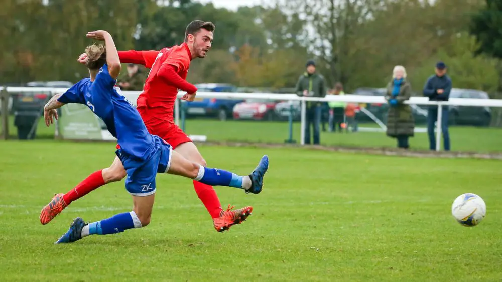 Joel Valentin takes a shot for Binfield against Fairford Town. Photo: Neil Graham / ngsportsphotography.com