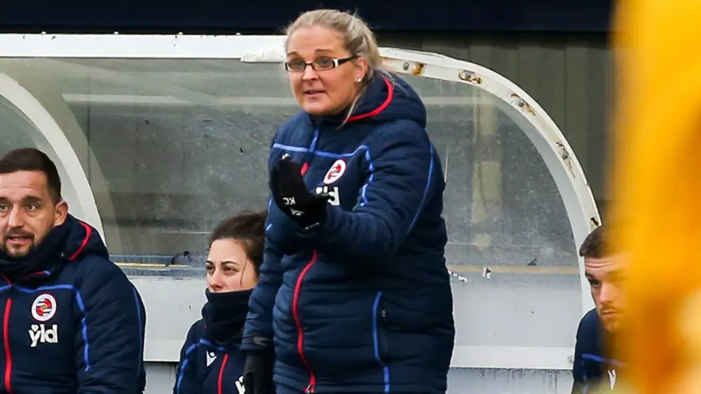 Reading FC Women manager Kelly Chambers directing her players during a football match.