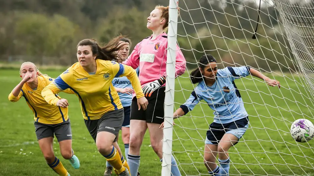 Rosie Page Smith scores for Woodley United Ladies. Photo: Neil Graham.