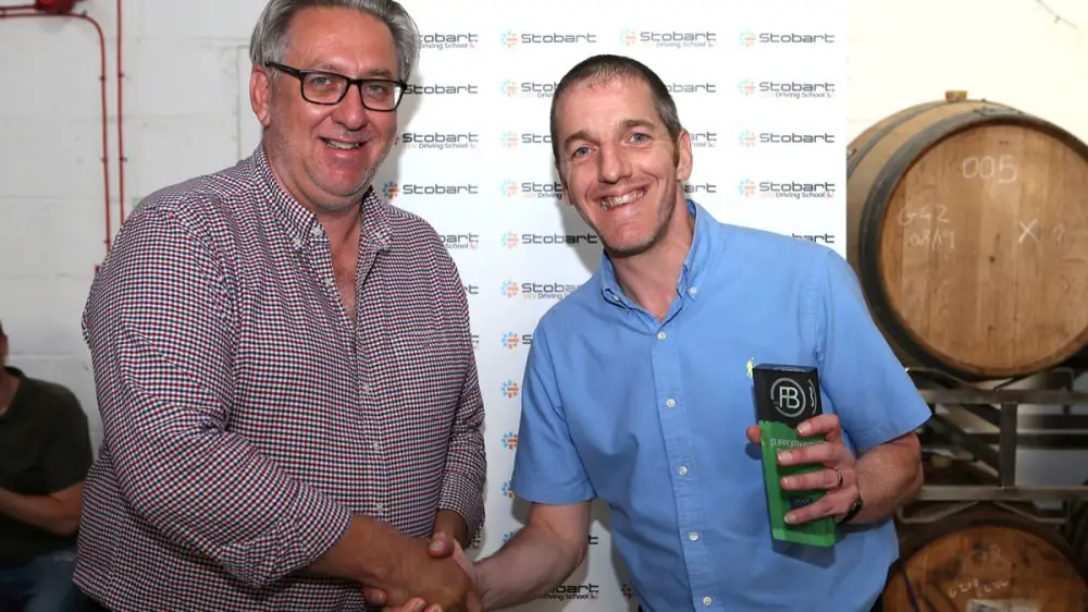 Windsor fan Ian Dawson with Ascot United chairman Simon Negus. Photo: Neil Graham