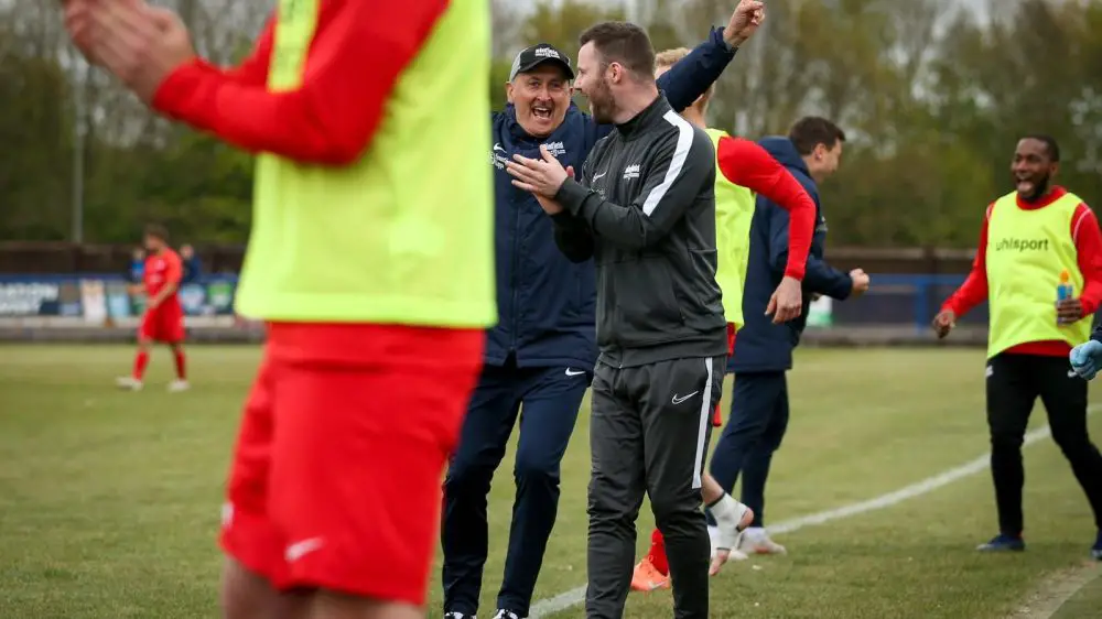 Roger Herridge celebrates in the Binfield FC dugout. Photo: Neil Graham / ngsportsphotography.com