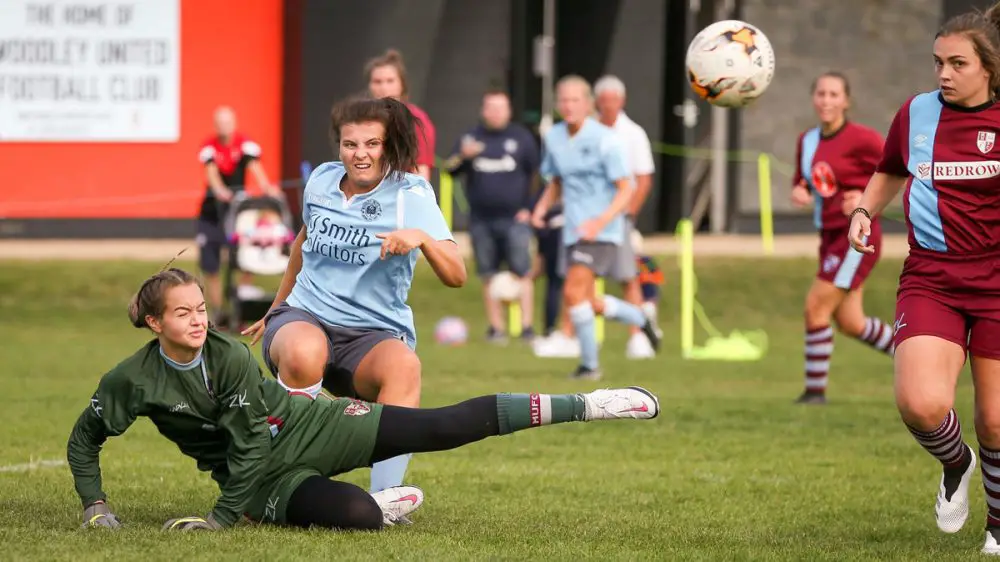 Rosie Page-Smith gets stuck in for 
Woodley United Ladies against Milton United. Photo: Neil Graham / ngsportsphotography.com
