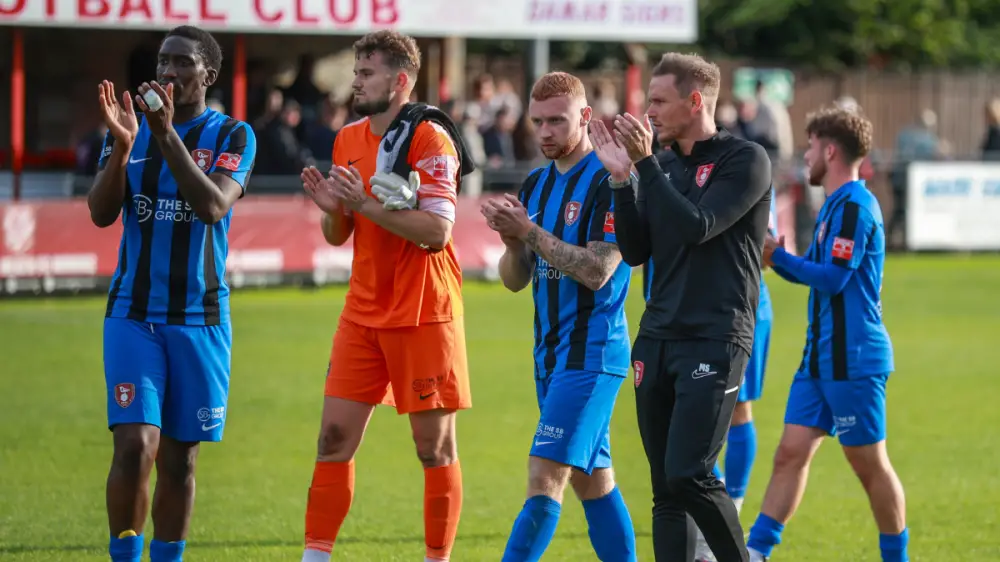 Bracknell Town players applaud supporters at the end of their FA Cup tie. Photo: John Leakey.