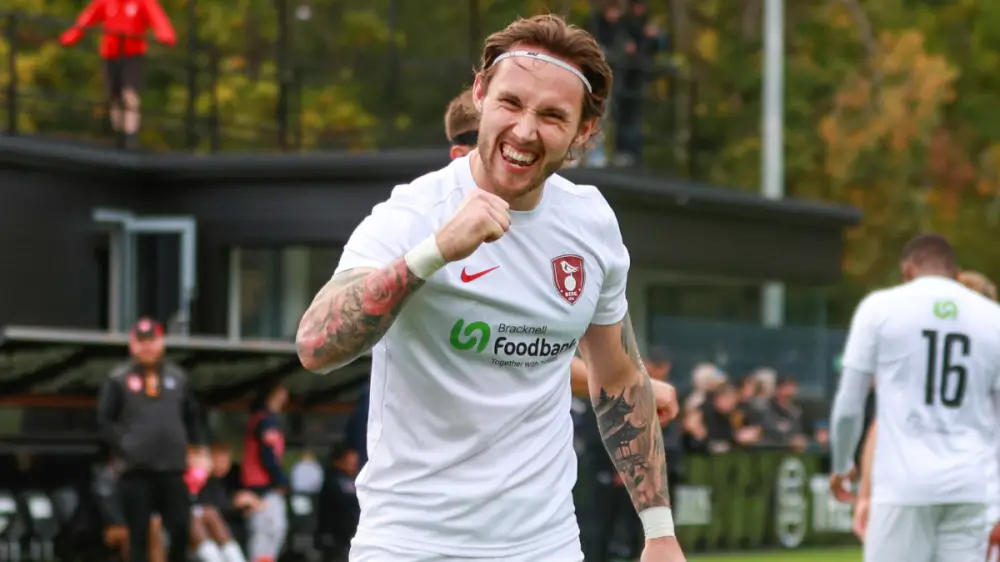 Joe Grant celebrates scoring for Bracknell Town. Photo: John Leakey.