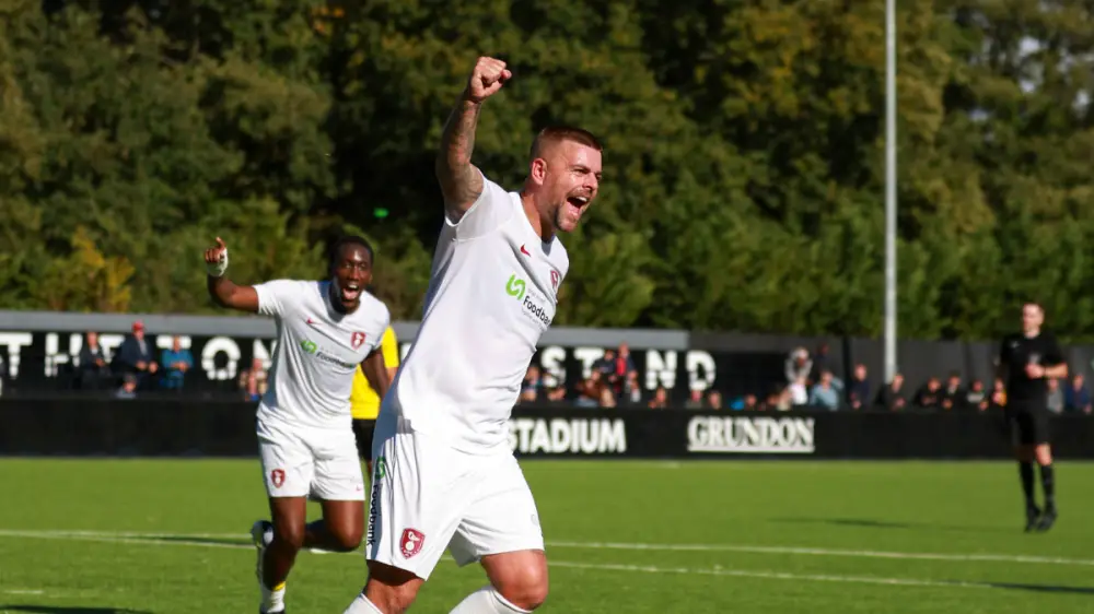 Sam Magri celebrates scoring for Bracknell Town. Photo: John Leakey.